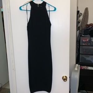 Black sleek dress with gold zipper